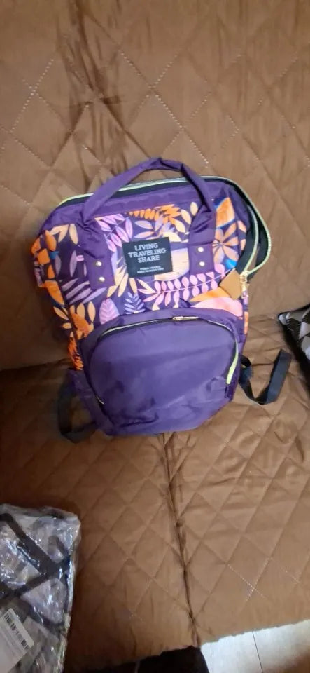 Photo du sac à dos à langer motif feuillage