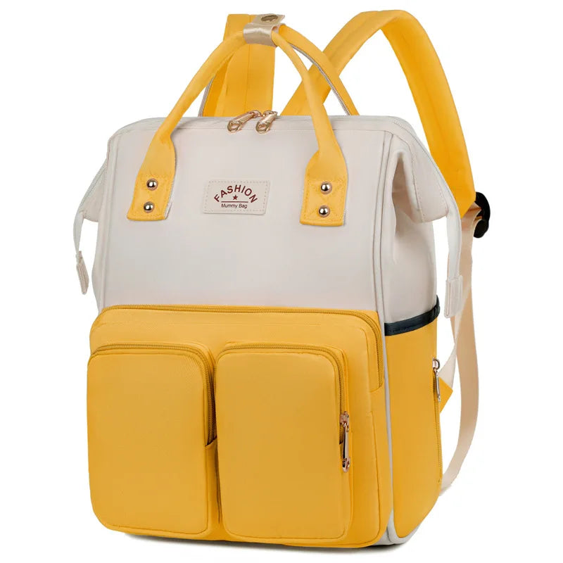 Sac à dos à langer avec anses de portage à la main