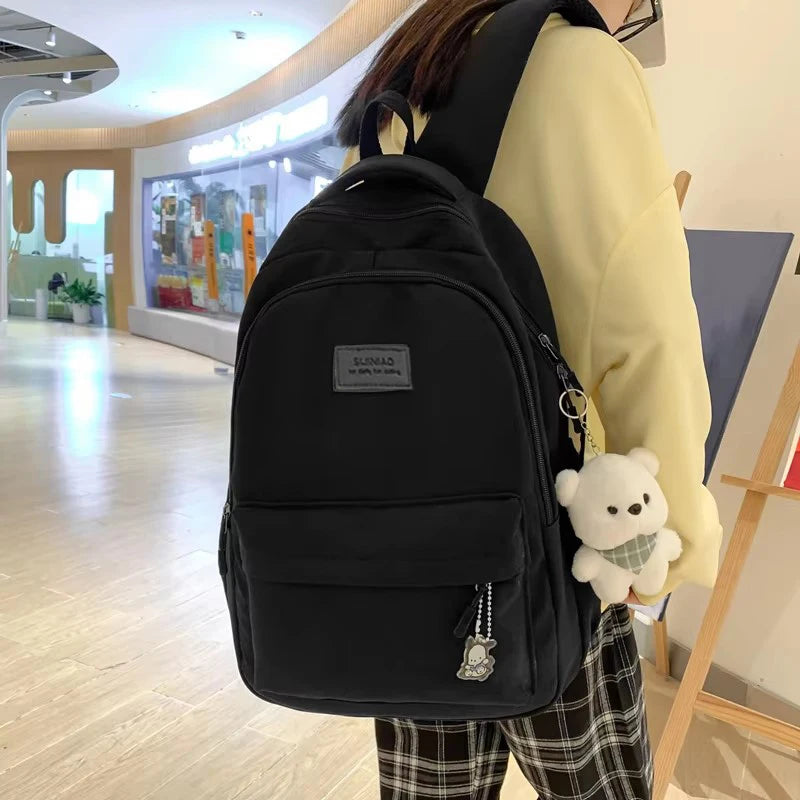 Sac à dos scolaire en nylon avec breloque peluche