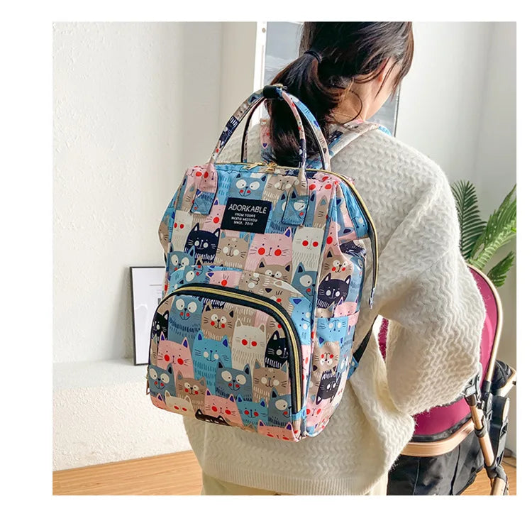 Sac à dos à langer avec poche isotherme biberon