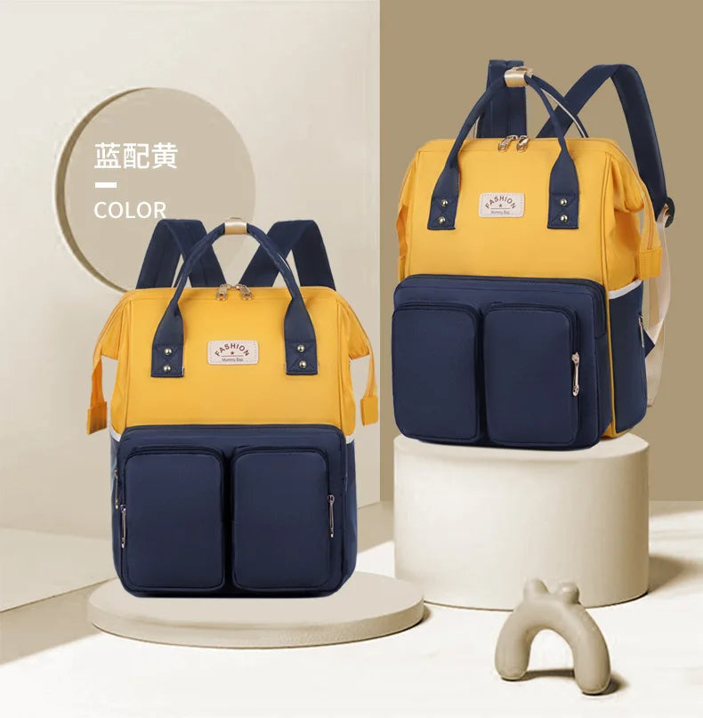 Sac à dos à langer avec anses de portage à la main