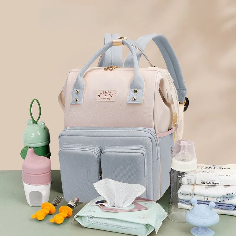 Sac à dos à langer avec anses de portage à la main