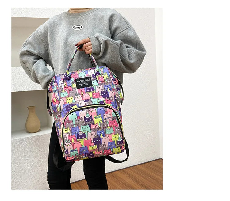 Sac à dos à langer avec poche isotherme biberon