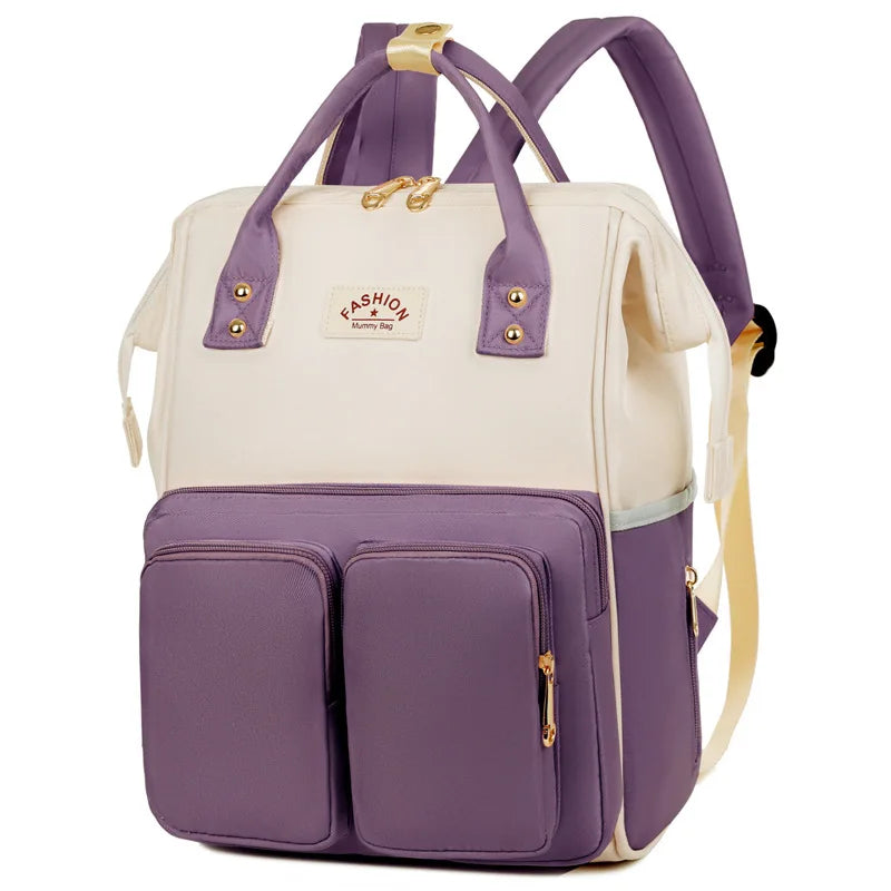 Sac à dos à langer avec anses de portage à la main