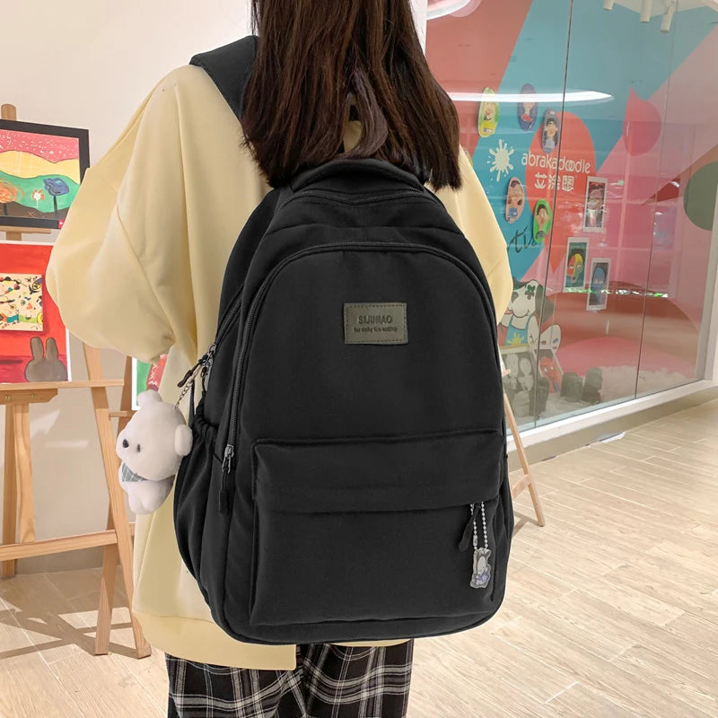 Sac à dos scolaire en nylon avec breloque peluche