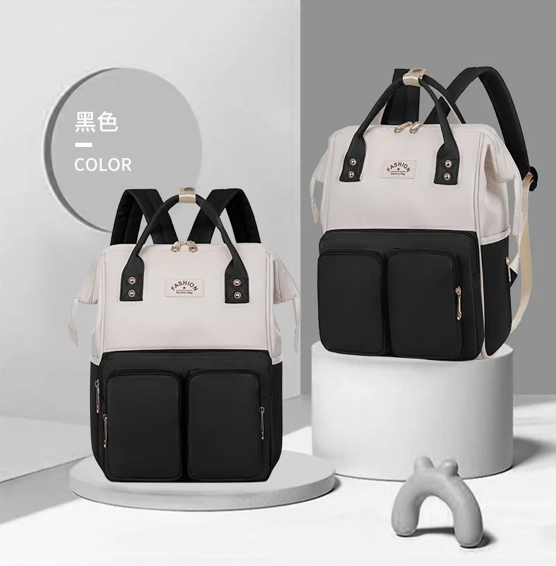 Sac à dos à langer avec anses de portage à la main